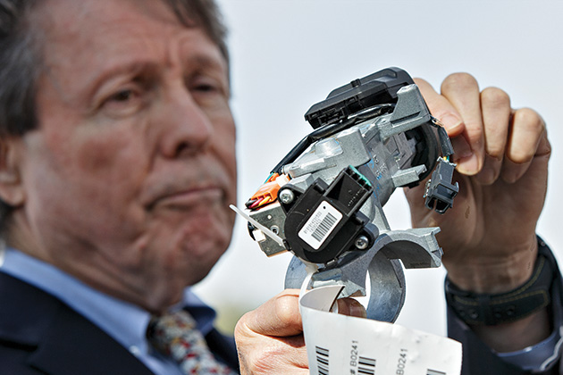 Center for Auto Safety Executive Director Clarence Ditlow displays a GM ignition switch.