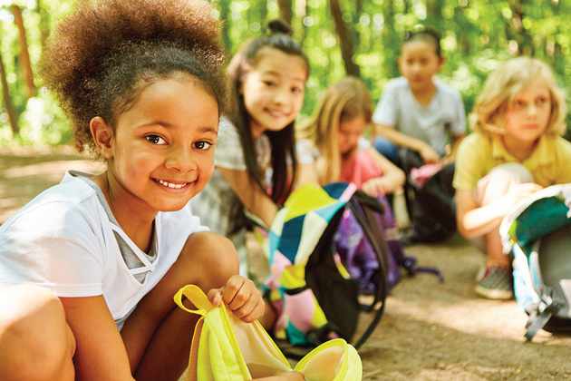 Smiling children at a summer camp.