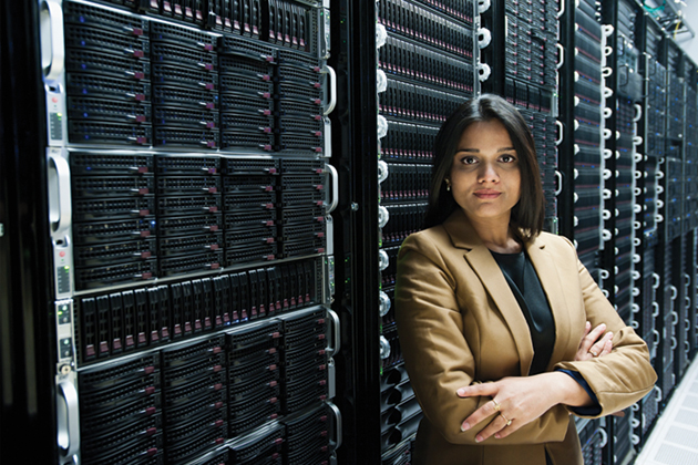 business woman in front of server racks