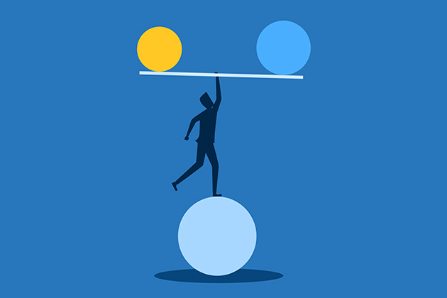 A silhoutted person balances on a large blue sphere while holding up a bar with a yellow and blue circle on either end against a blue background